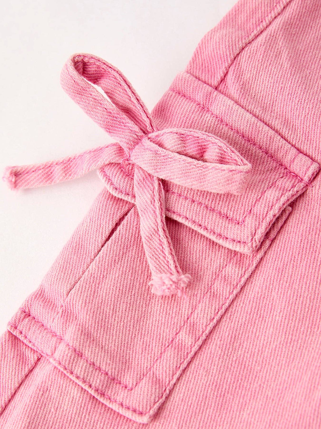 Pink Bell Bottom Jeans With Cargo Pockets And Frayed Hem Detail