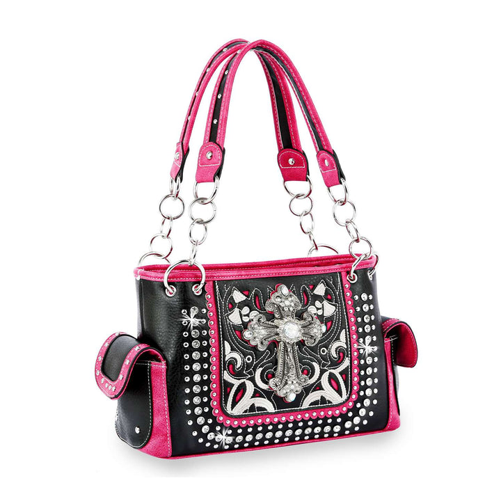 Black and pink handbag with decorative cross and studs on a white background